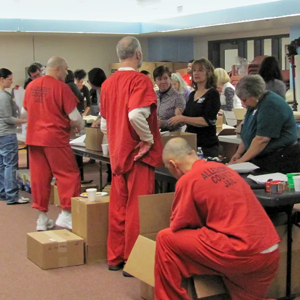 Group of volunteers working with incarcerated individuals